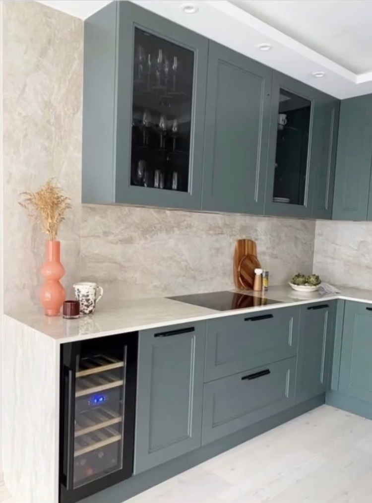 Custom green Shaker cabinetry with quartz countertop in Palm Beach Gardens