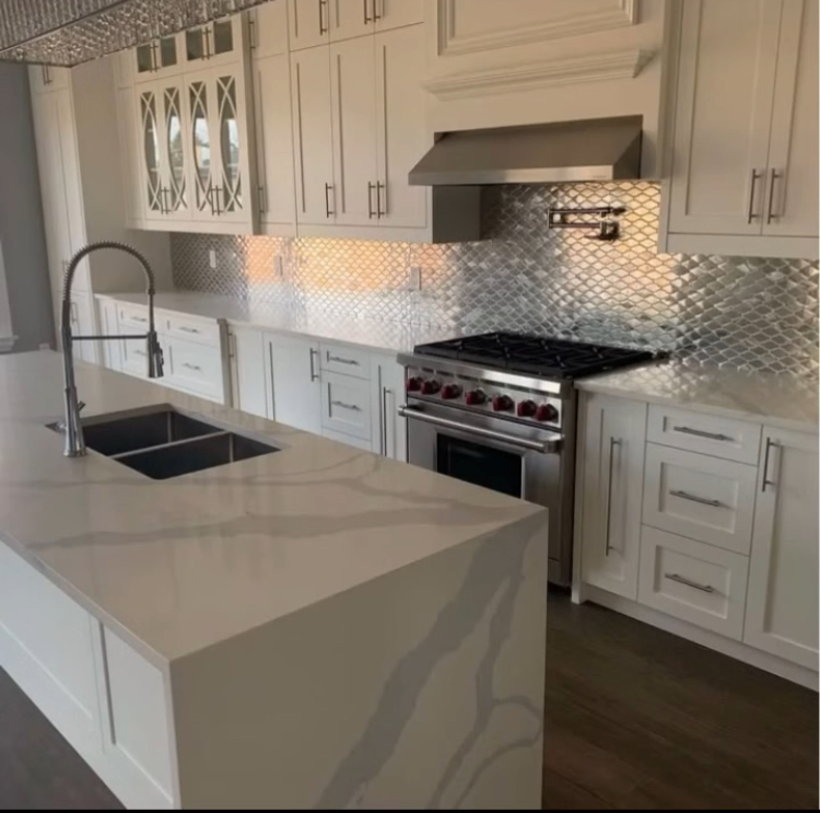 Kitchen renovation with new cabinets, countertops and backsplash