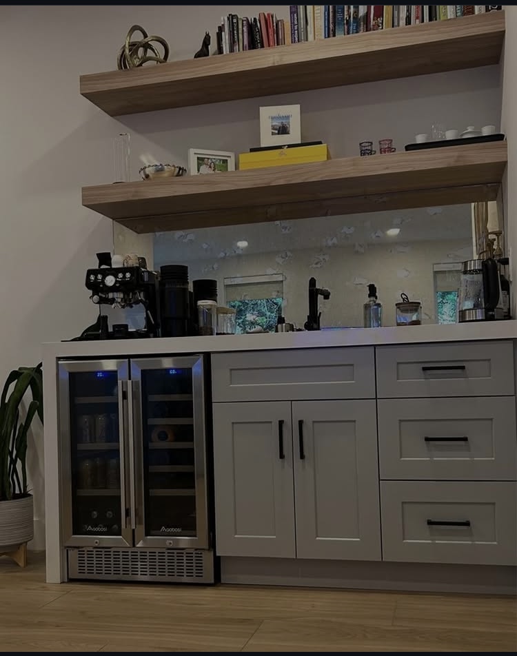 Custom built-in cabinetry and beverage bar by LuxeCraft Renovations