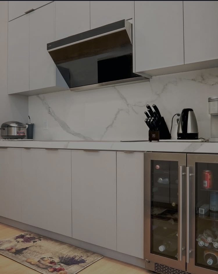 Modern flat door kitchen, cabinetry, and hood renovation in Palm Beach County