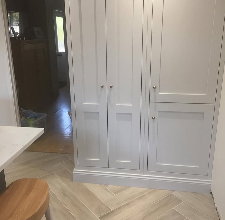 Custom built cabinets, pantry, herringbone floor, in kitchen in Jupiter, Florida