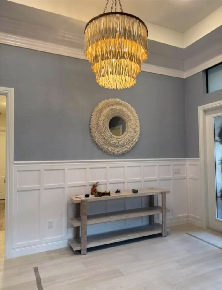 Interior wall with custom white molding and decorative trim work